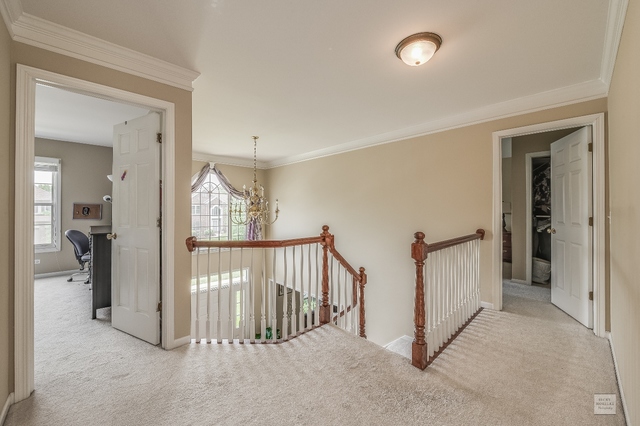1805 Marne Road Bolingbrook, IL 60490 - Photo 16 of 27 a view of a hallway with a livingroom and entryway
