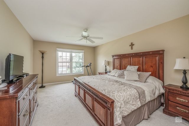 1805 Marne Road Bolingbrook, IL 60490 - Photo 17 of 27 a bedroom with a bed and a flat screen tv