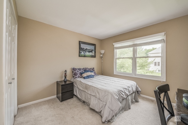 1805 Marne Road Bolingbrook, IL 60490 - Photo 19 of 27 a bedroom with a bed and a window