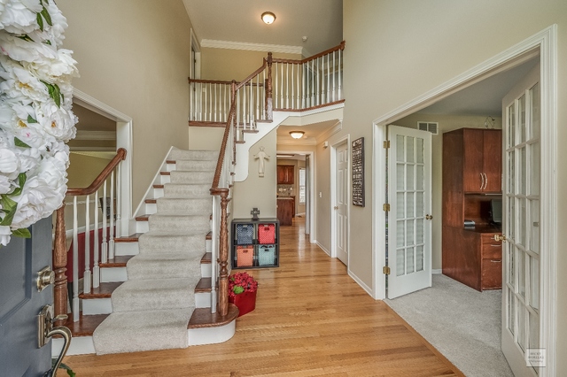 1805 Marne Road Bolingbrook, IL 60490 - Photo 3 of 27 a view of entryway with wooden floor and stairs