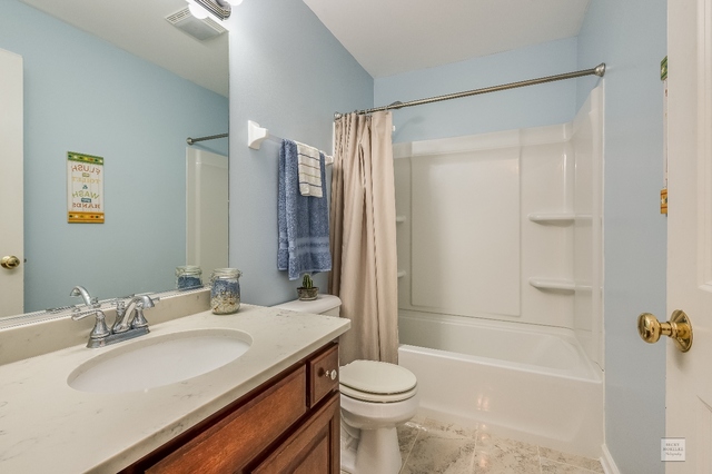 1805 Marne Road Bolingbrook, IL 60490 - Photo 21 of 27 a bathroom with a sink toilet and shower