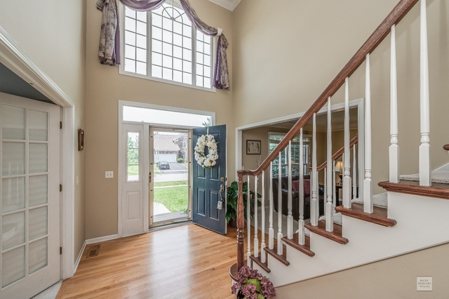 1805 Marne Road Bolingbrook, IL 60490 - Photo 23 of 27 a view of entryway with wooden floor and stairs