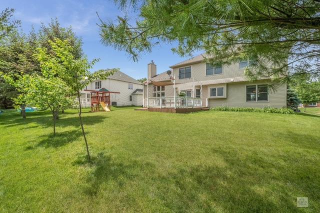 1805 Marne Road Bolingbrook, IL 60490 - Photo 26 of 27 a front view of a house with a yard table and chairs