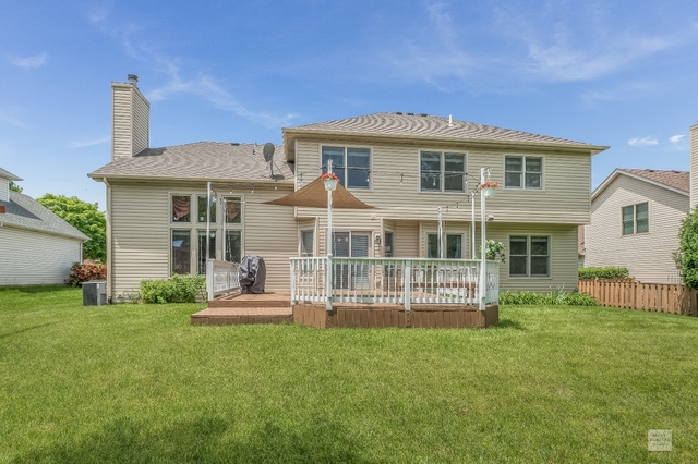 1805 Marne Road Bolingbrook, IL 60490 - Photo 27 of 27 a front view of a house with a garden