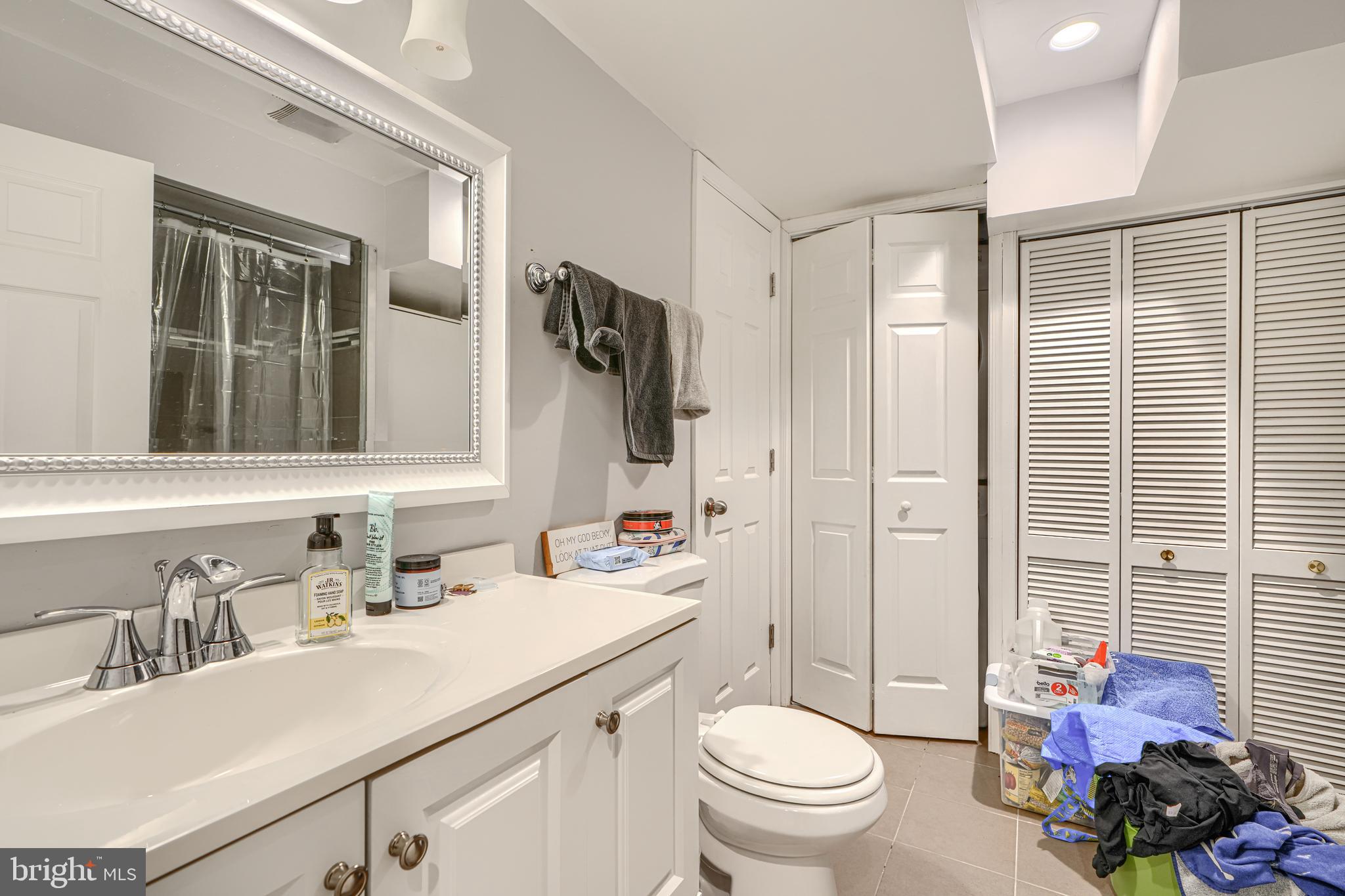 108 North Madeira Street Baltimore, MD 21231 - Photo 12 of 17 a bathroom with a sink toilet vanity and shower