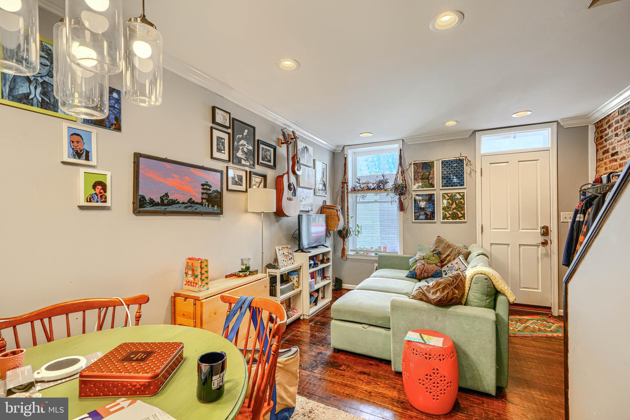 108 North Madeira Street Baltimore, MD 21231 - Photo 3 of 17 a living room with furniture and a flat screen tv