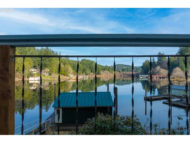 a view of a living room and floor to ceiling window