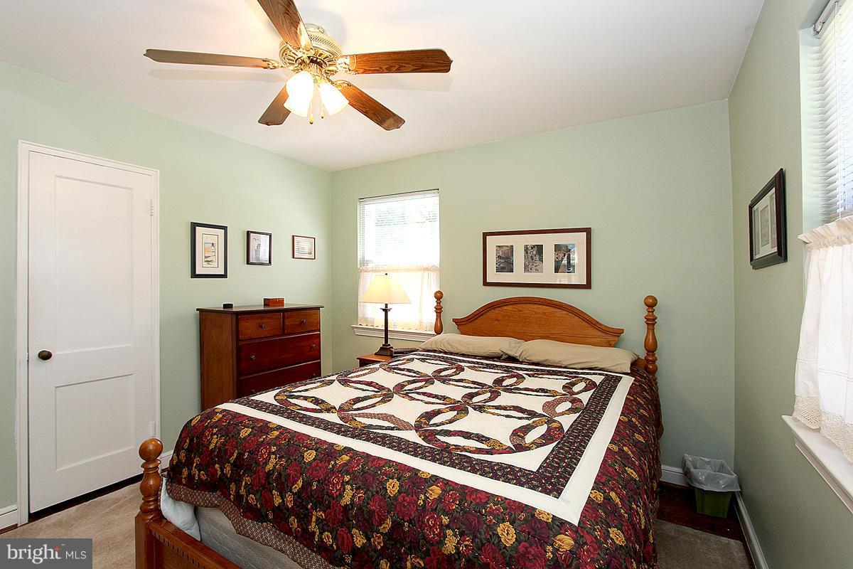 10011 Portland Road Silver Spring, MD 20901 - Photo 13 of 24 Bedroom with 2 windows, hardwood floors