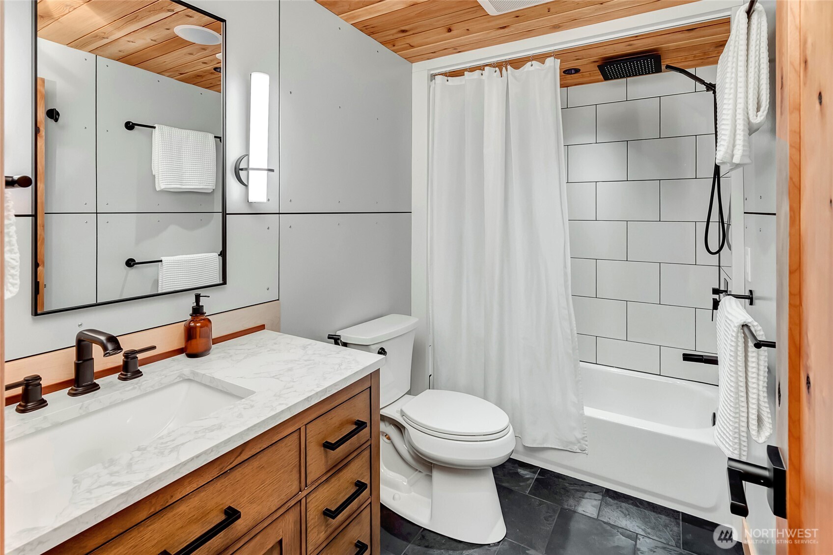 24123 7th Avenue West Bothell, WA 98021 - Photo 18 of 29 a bathroom with a sink a toilet and shower