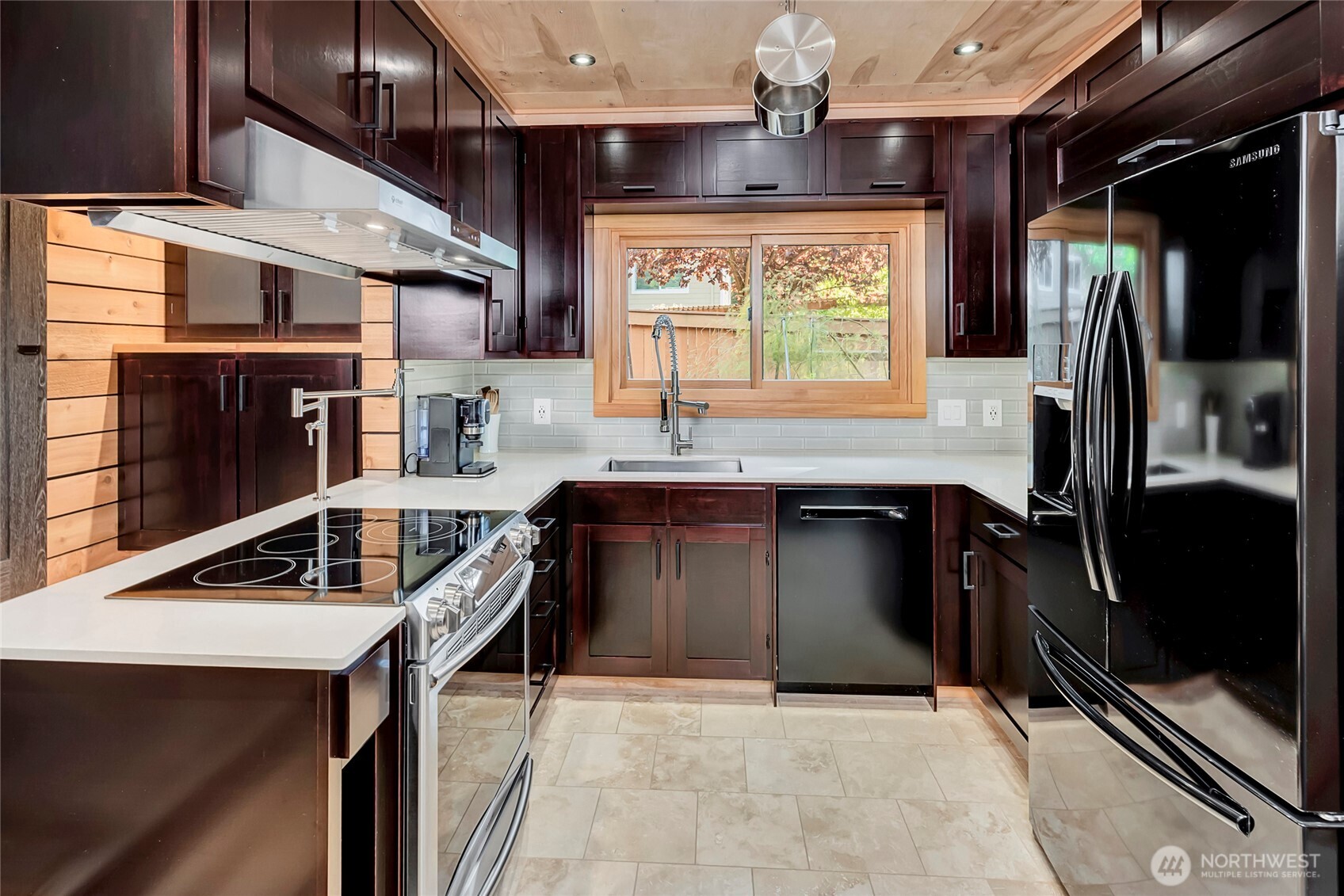 24123 7th Avenue West Bothell, WA 98021 - Photo 10 of 29 a kitchen with stainless steel appliances granite countertop a stove a sink and a microwave