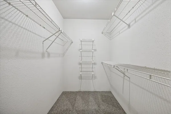 a view of storage and utility room with racks on the wall