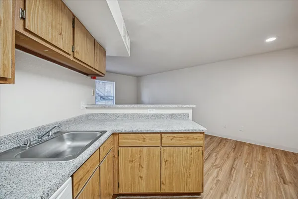 a kitchen with a sink and cabinets