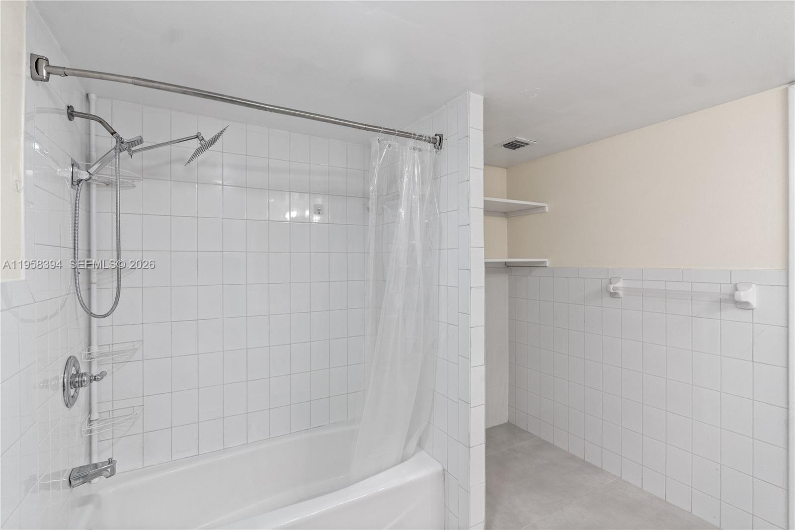 6907 Southwest 115th Place, Unit D40 Miami, FL 33173 - Photo 11 of 38 a bathroom with a shower
