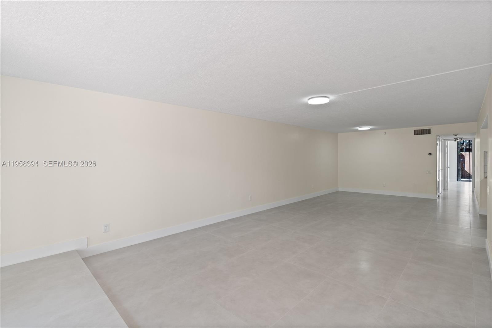 6907 Southwest 115th Place, Unit D40 Miami, FL 33173 - Photo 16 of 38 a view of an empty room