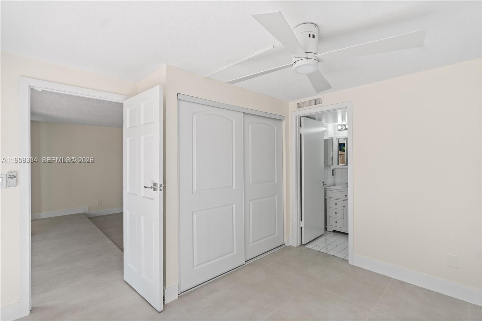 6907 Southwest 115th Place, Unit D40 Miami, FL 33173 - Photo 22 of 38 an empty room with a ceiling fan and a ceiling fan