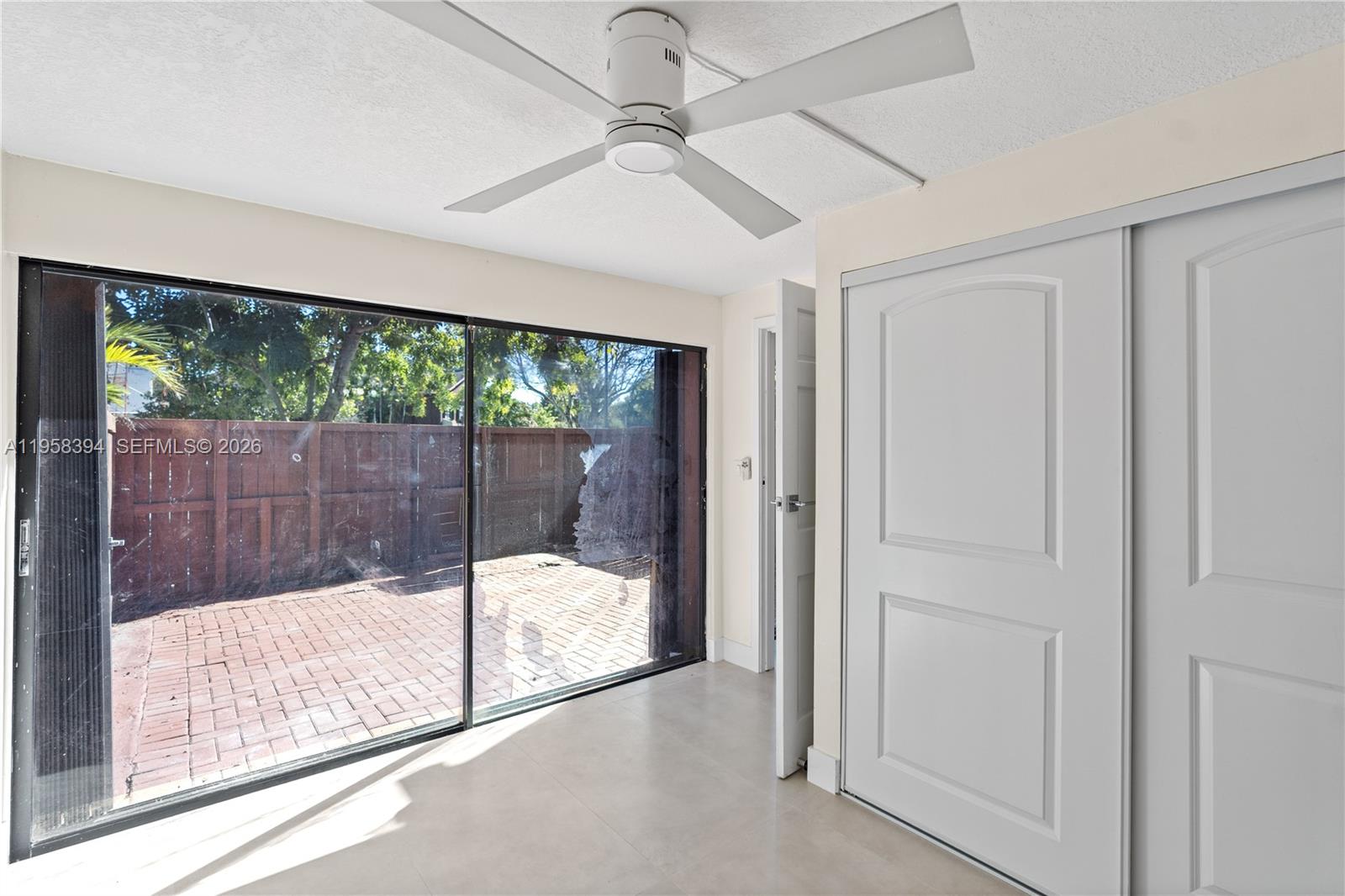 6907 Southwest 115th Place, Unit D40 Miami, FL 33173 - Photo 23 of 38 a view of a room with sliding glass door