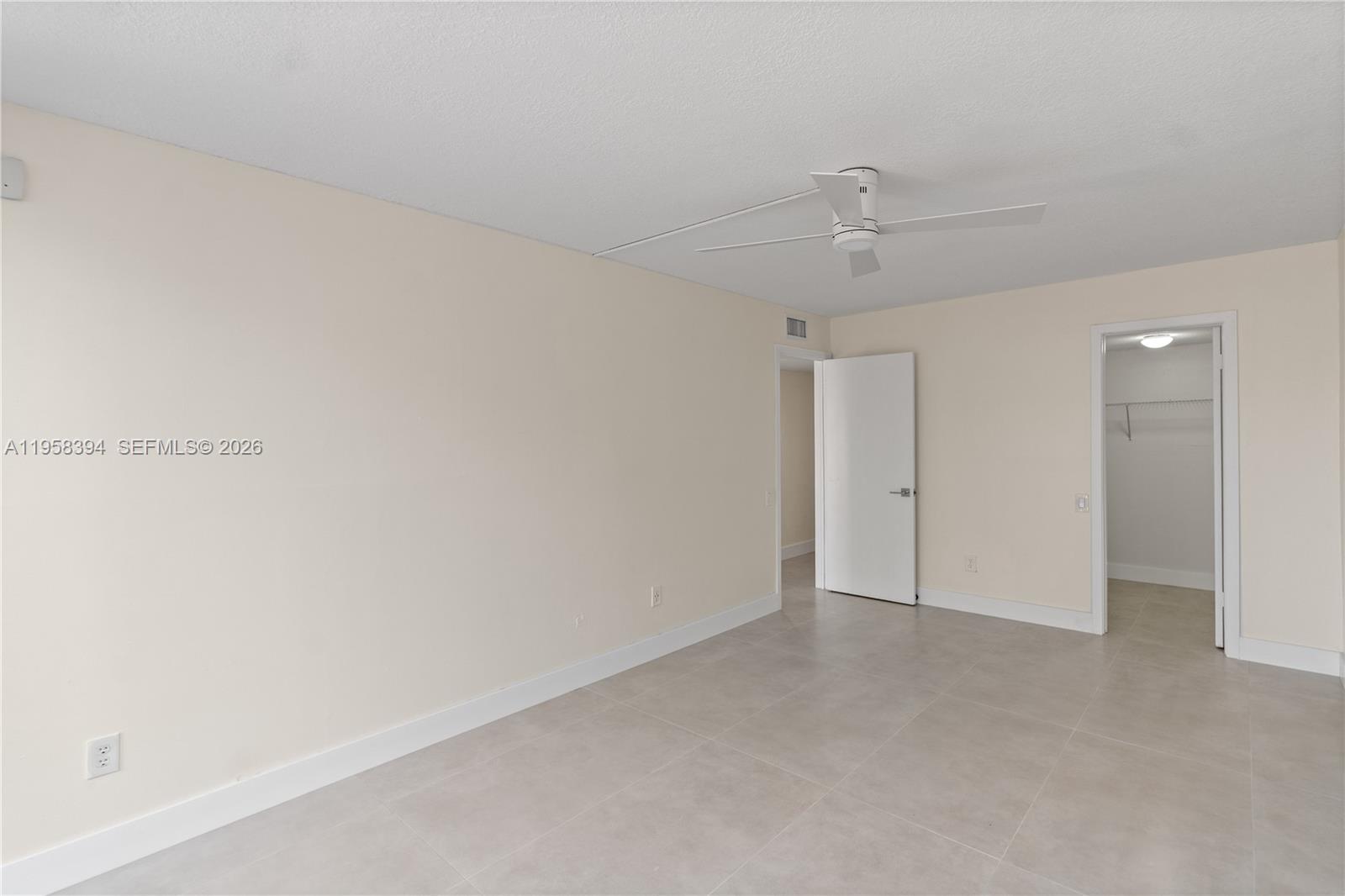 6907 Southwest 115th Place, Unit D40 Miami, FL 33173 - Photo 27 of 38 a view of an empty room