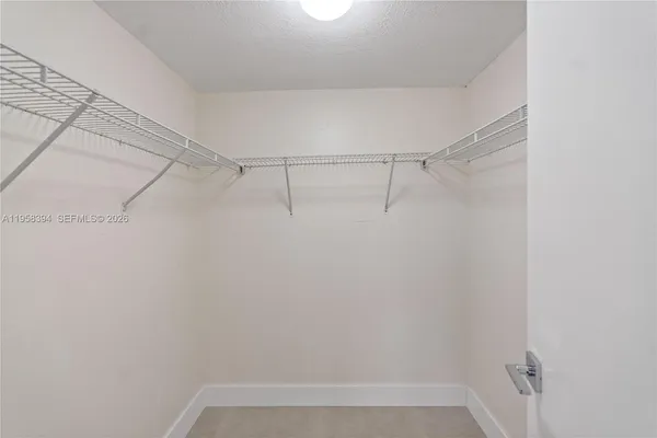 a view of a room with racks on the wall