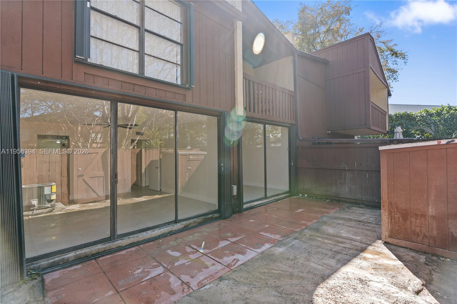 6907 Southwest 115th Place, Unit D40 Miami, FL 33173 - Photo 33 of 38 a view of a glass door of the house
