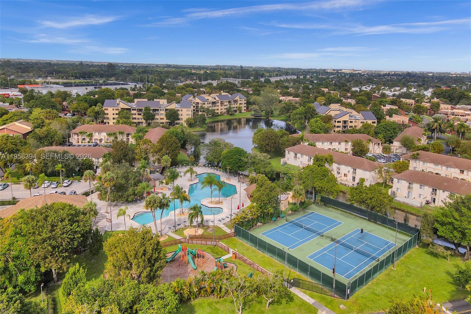 6907 Southwest 115th Place, Unit D40 Miami, FL 33173 - Photo 35 of 38 an aerial view of residential houses with outdoor space and city view