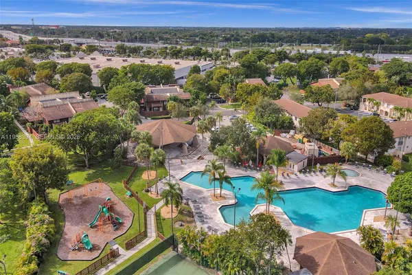 an aerial view of residential houses with outdoor space