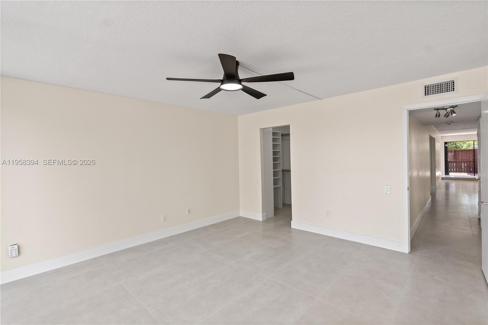 6907 Southwest 115th Place, Unit D40 Miami, FL 33173 - Photo 5 of 38 a view of an empty room
