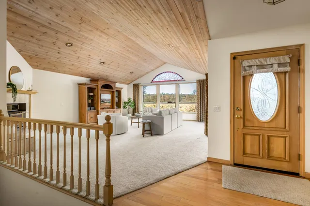 a view of living room filled with furniture and wooden floor