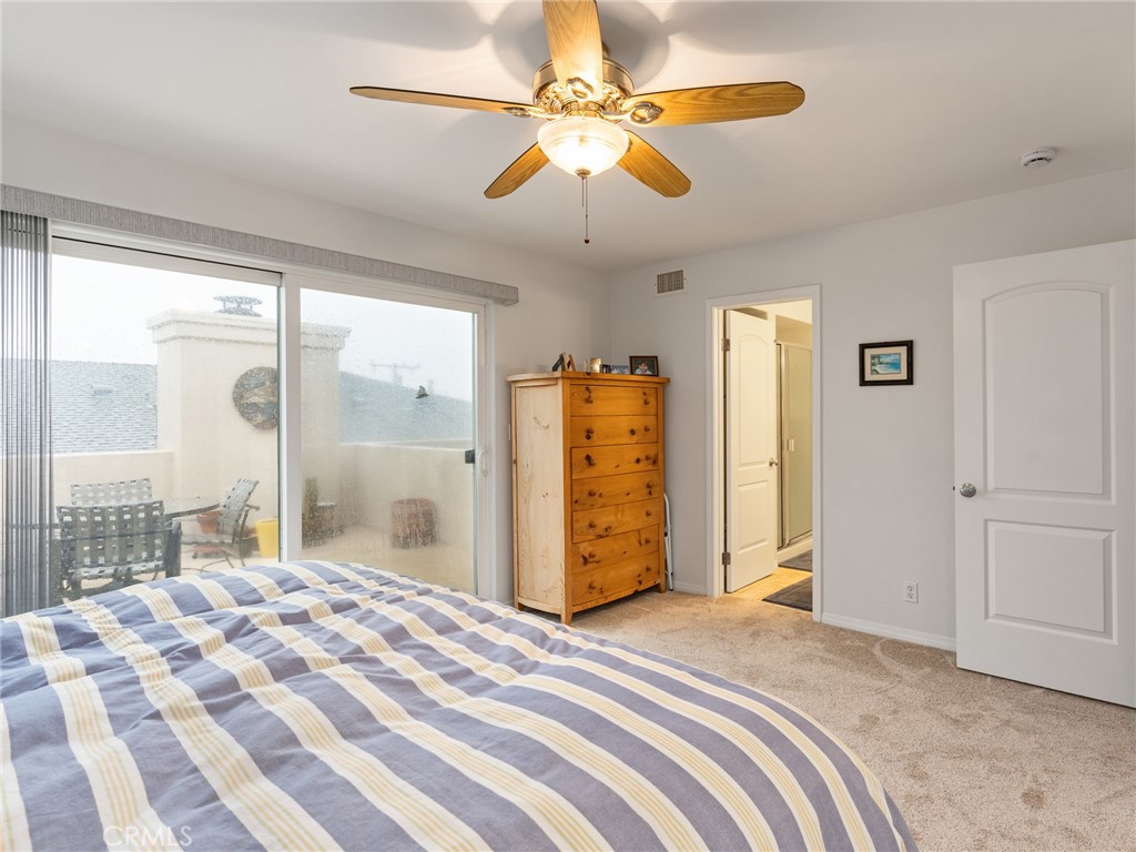 328 Virginia Street, Unit 4 El Segundo, CA 90245 - Photo 15 of 26 a bedroom with a bed and a chandelier