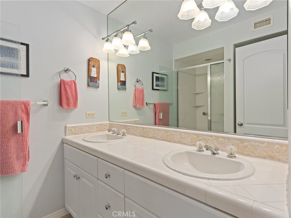 328 Virginia Street, Unit 4 El Segundo, CA 90245 - Photo 16 of 26 a bathroom with a sink and a mirror