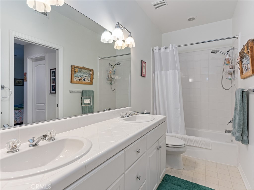 328 Virginia Street, Unit 4 El Segundo, CA 90245 - Photo 18 of 26 a bathroom with a sink a toilet a large mirror and shower