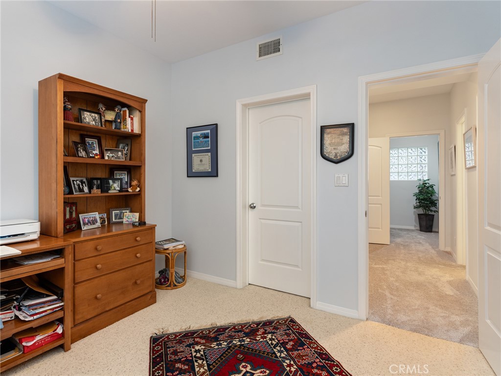 328 Virginia Street, Unit 4 El Segundo, CA 90245 - Photo 22 of 26 a bedroom with furniture and a book shelf