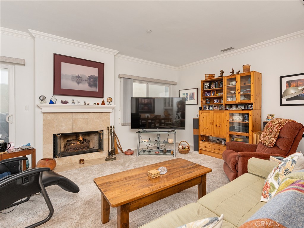 328 Virginia Street, Unit 4 El Segundo, CA 90245 - Photo 5 of 26 a living room with furniture a flat screen tv and a fireplace