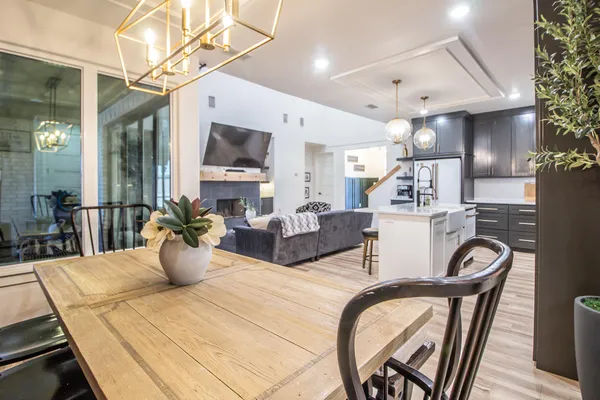 a large kitchen with a table and chairs