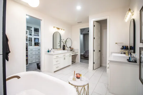 a bathroom with a sink a vanity and a mirror