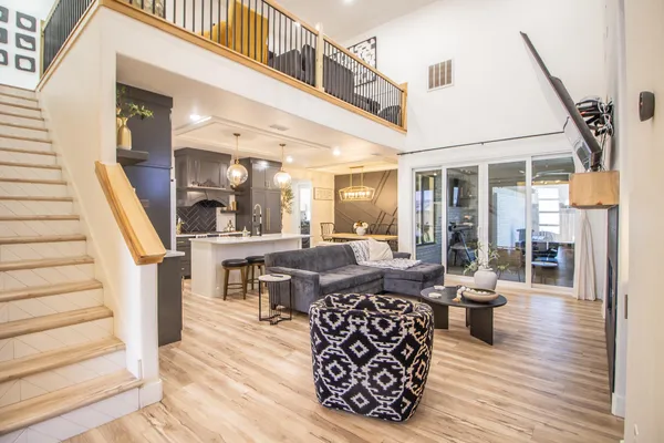 a living room with furniture a fireplace and a table