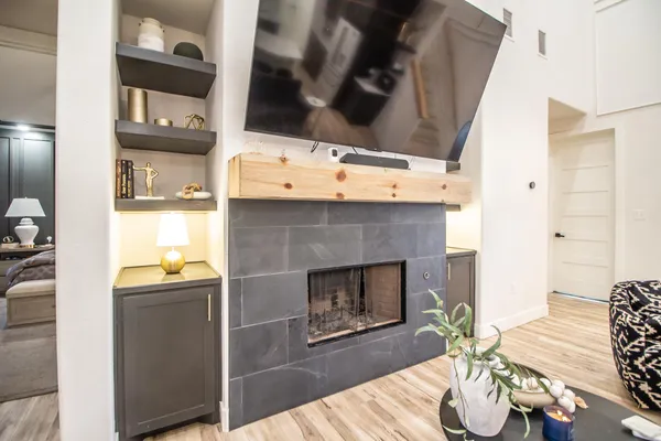 a living room with furniture and a fireplace