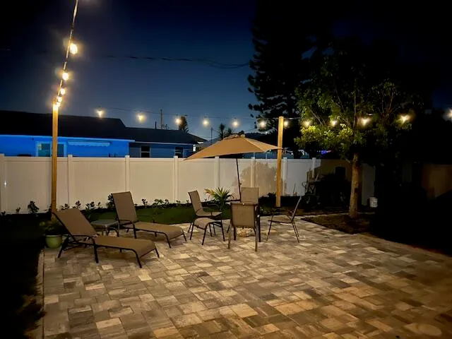 a couple of chairs sitting in patio of a house