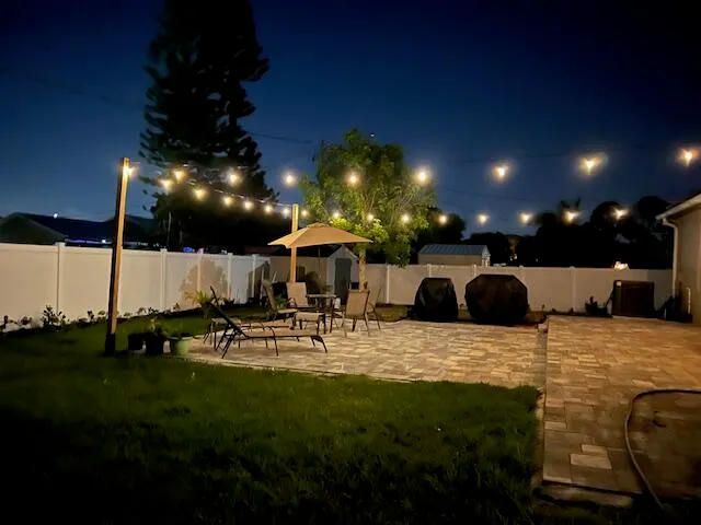 a view of a chairs and table in patio