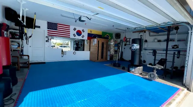 a room with lots of gym equipment