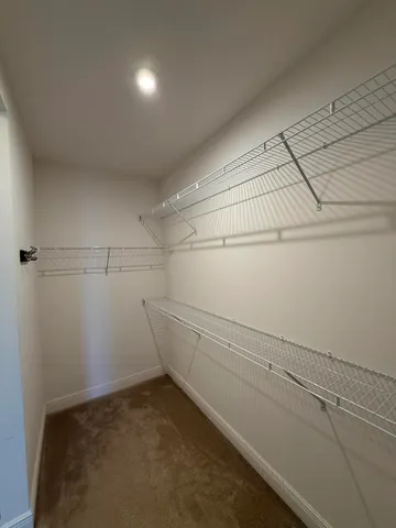 a view of a room with racks on the wall