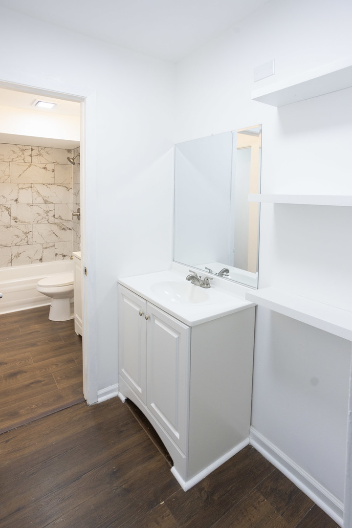35 Churn Road, Unit 35 Matteson, IL 60443 - Photo 13 of 18 a bathroom with a sink vanity and a mirror