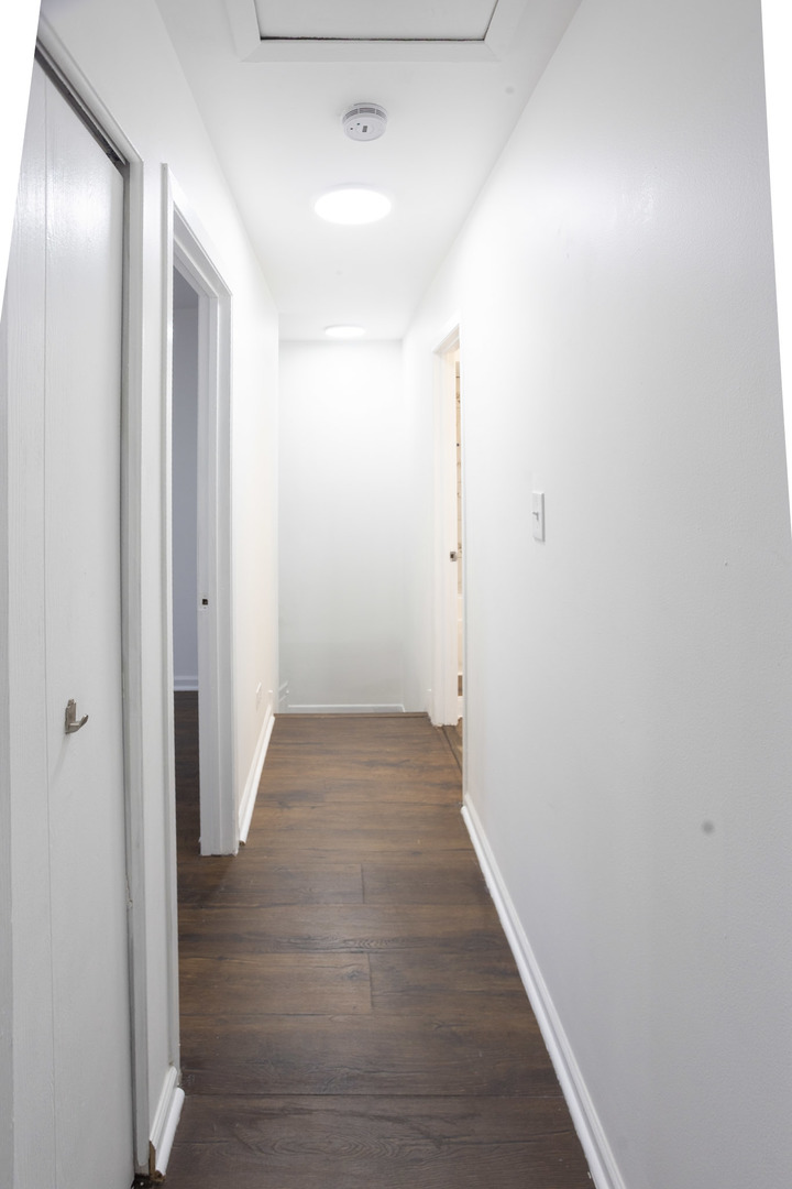35 Churn Road, Unit 35 Matteson, IL 60443 - Photo 17 of 18 a view of a hallway with wooden floor