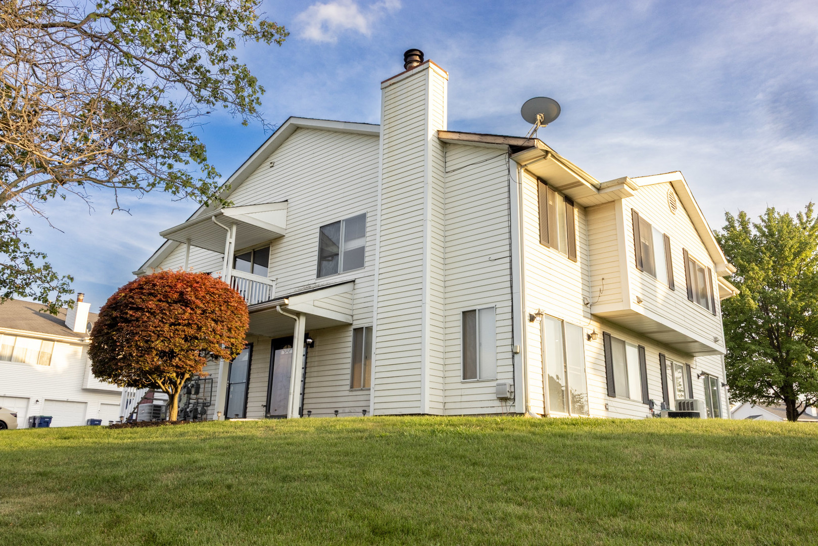 35 Churn Road, Unit 35 Matteson, IL 60443 - Photo 2 of 18 a front view of a house with a yard