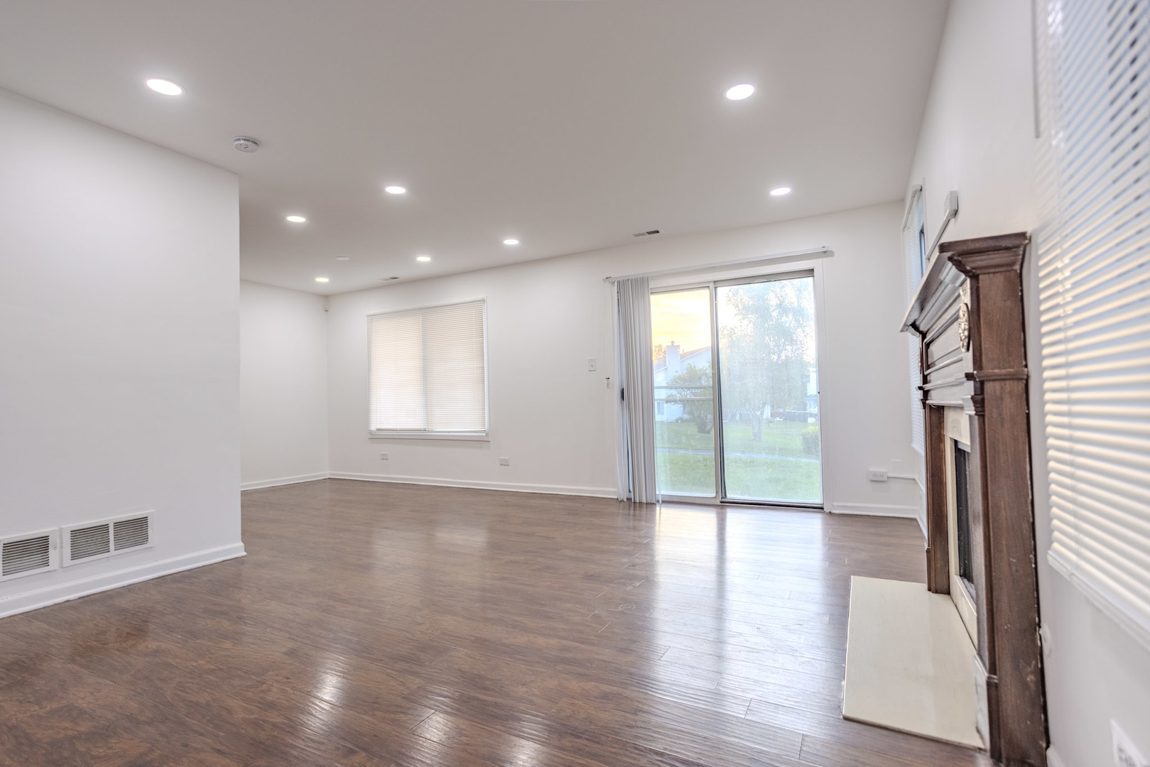 35 Churn Road, Unit 35 Matteson, IL 60443 - Photo 3 of 18 a view of an empty room with wooden floor and a window