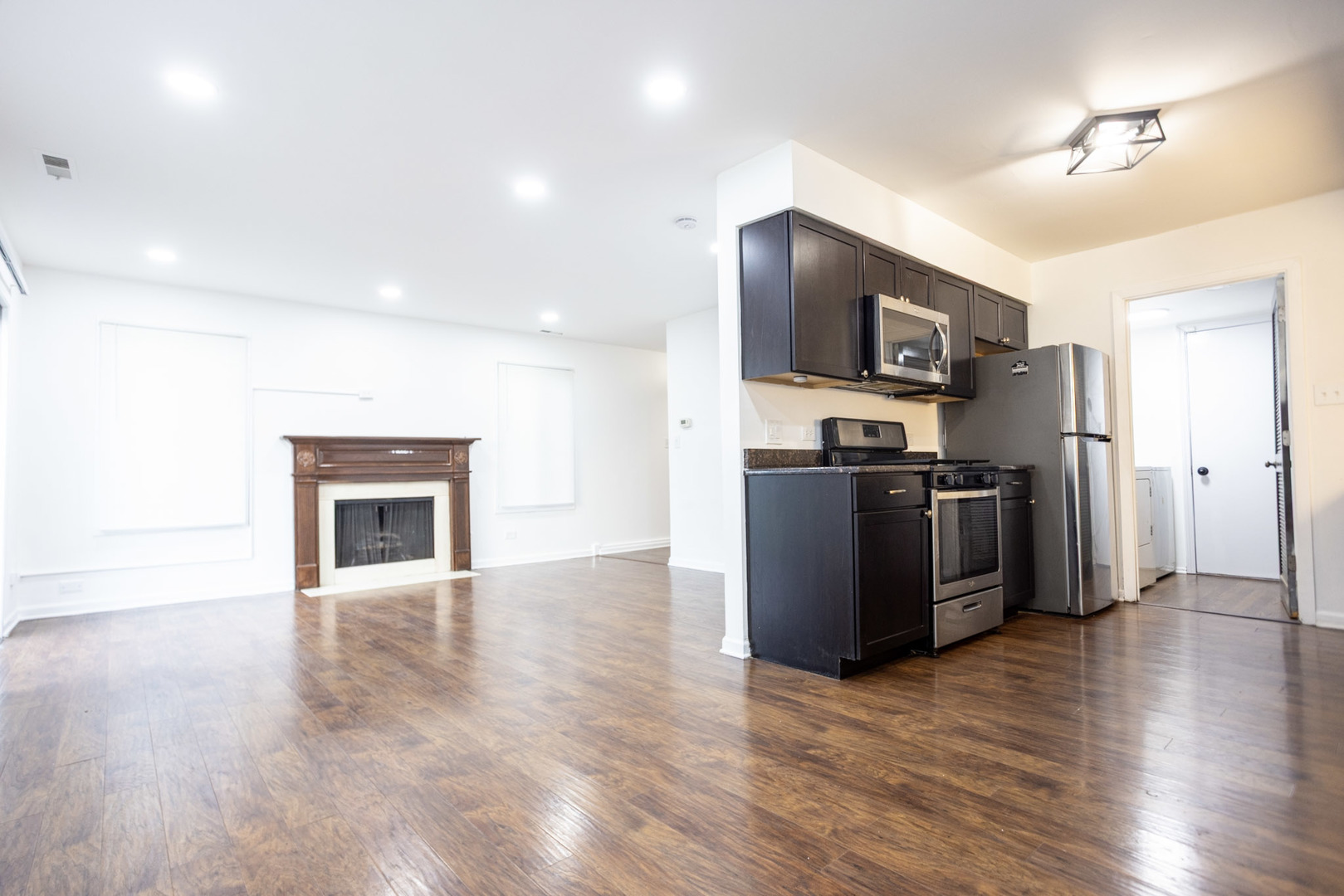 35 Churn Road, Unit 35 Matteson, IL 60443 - Photo 4 of 18 a view of kitchen with stainless steel appliances wooden floor and living room
