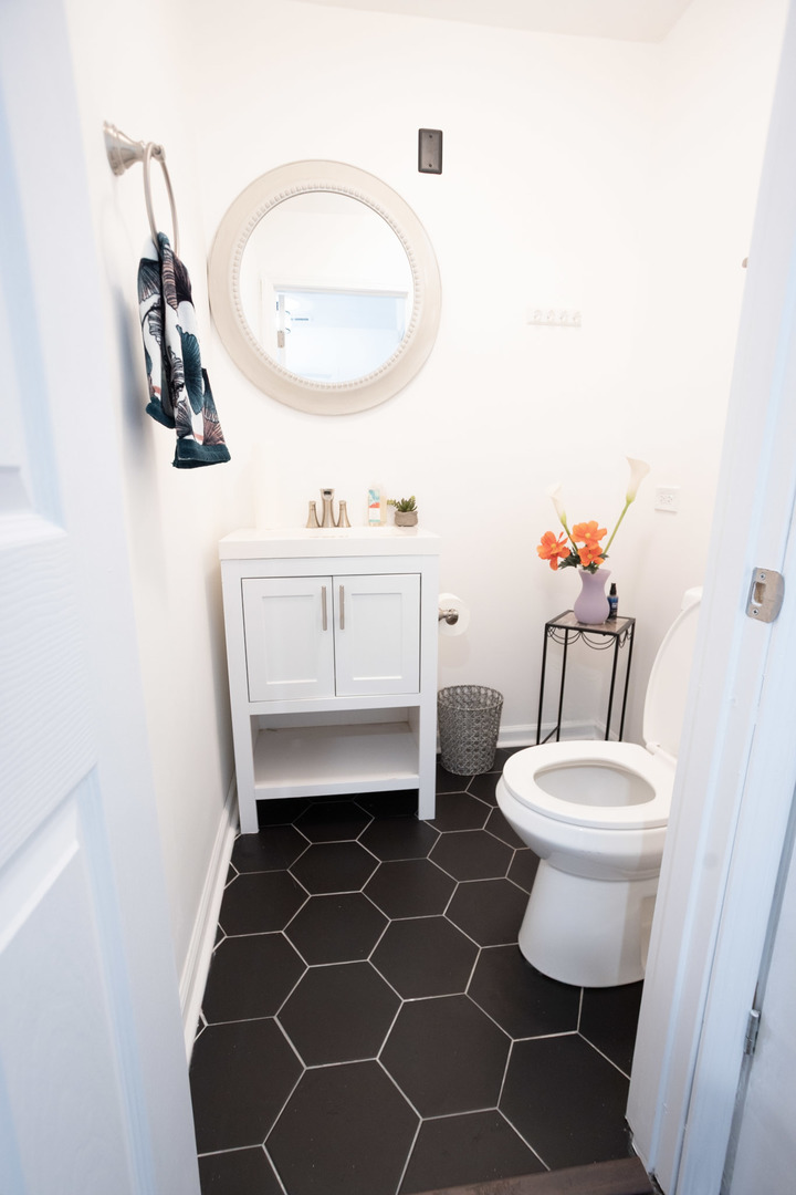 35 Churn Road, Unit 35 Matteson, IL 60443 - Photo 8 of 18 a bathroom with a sink toilet and a mirror