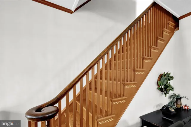 a view of staircase with wooden floor and stairs