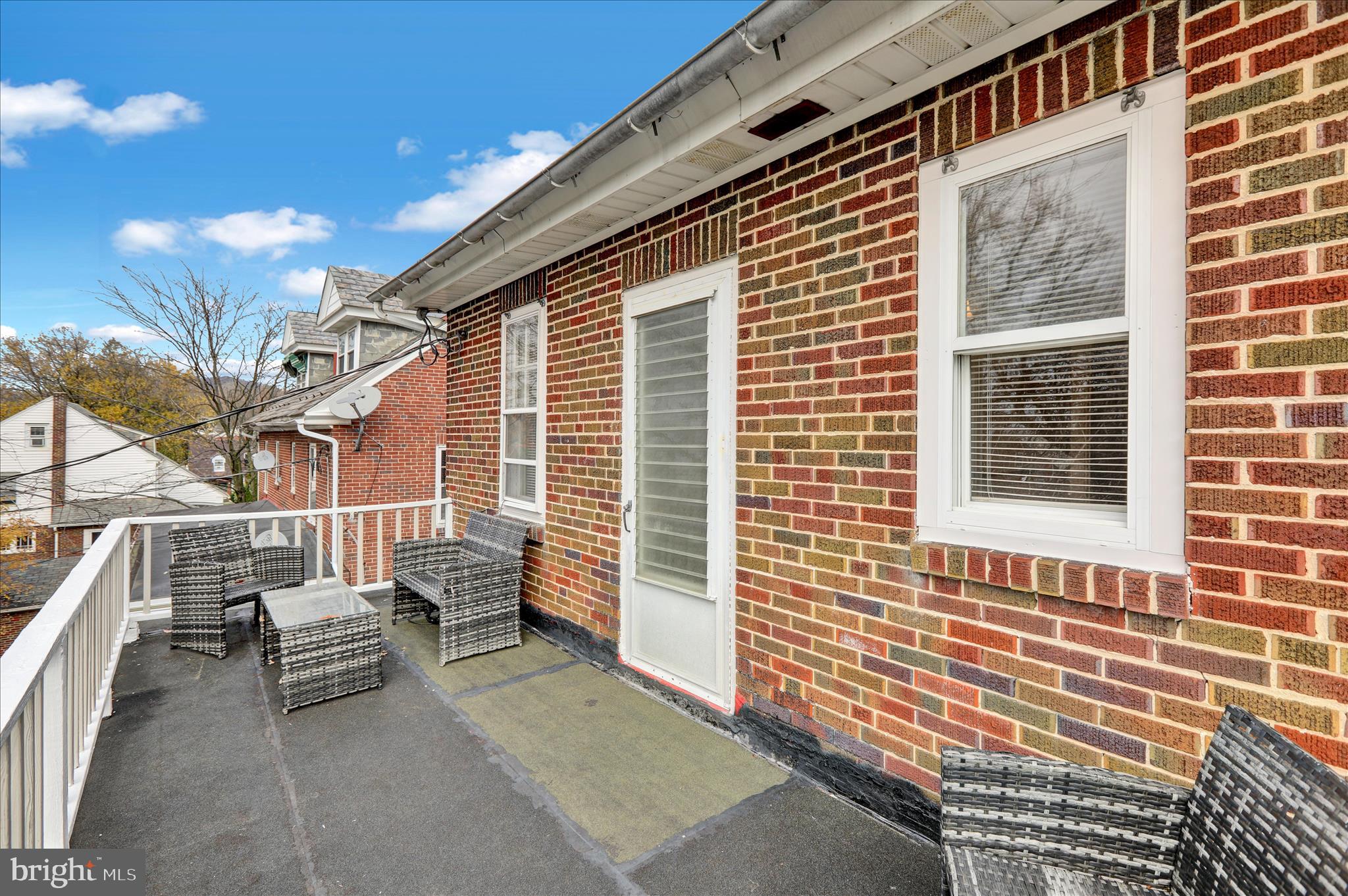 1722 Olive Street Reading, PA 19604 - Photo 18 of 31 a view of a patio with a table and chairs and wooden fence