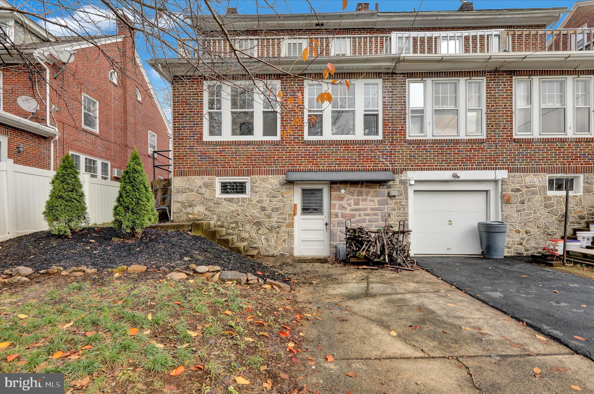 1722 Olive Street Reading, PA 19604 - Photo 25 of 31 a view of a brick building next to a yard