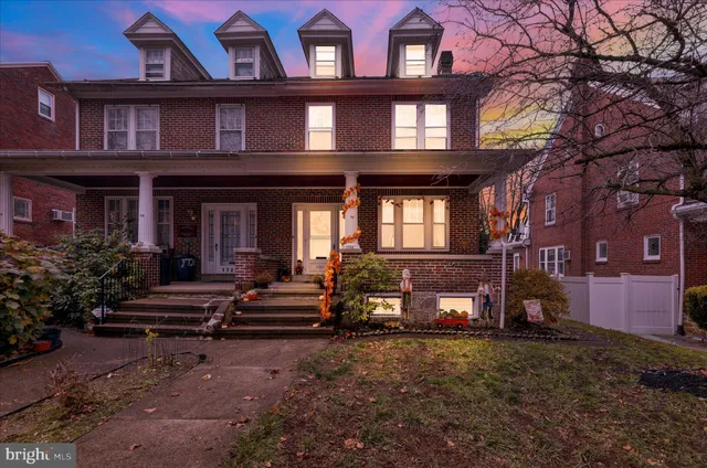 a view of a building next to a yard
